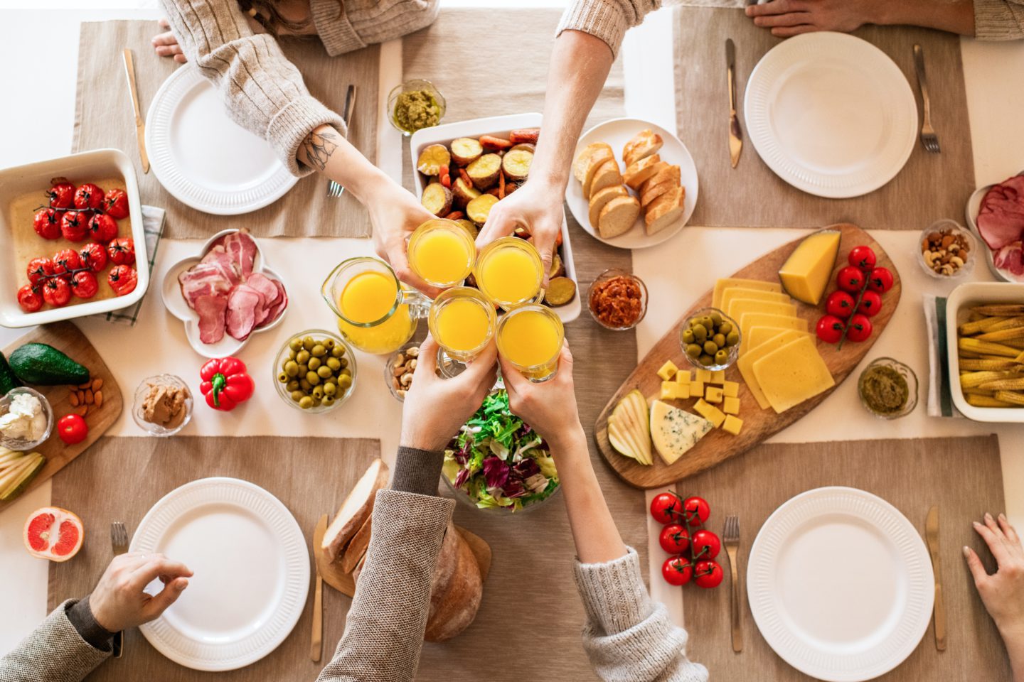 Overhead photo of people enjoying a Mother's Day spread